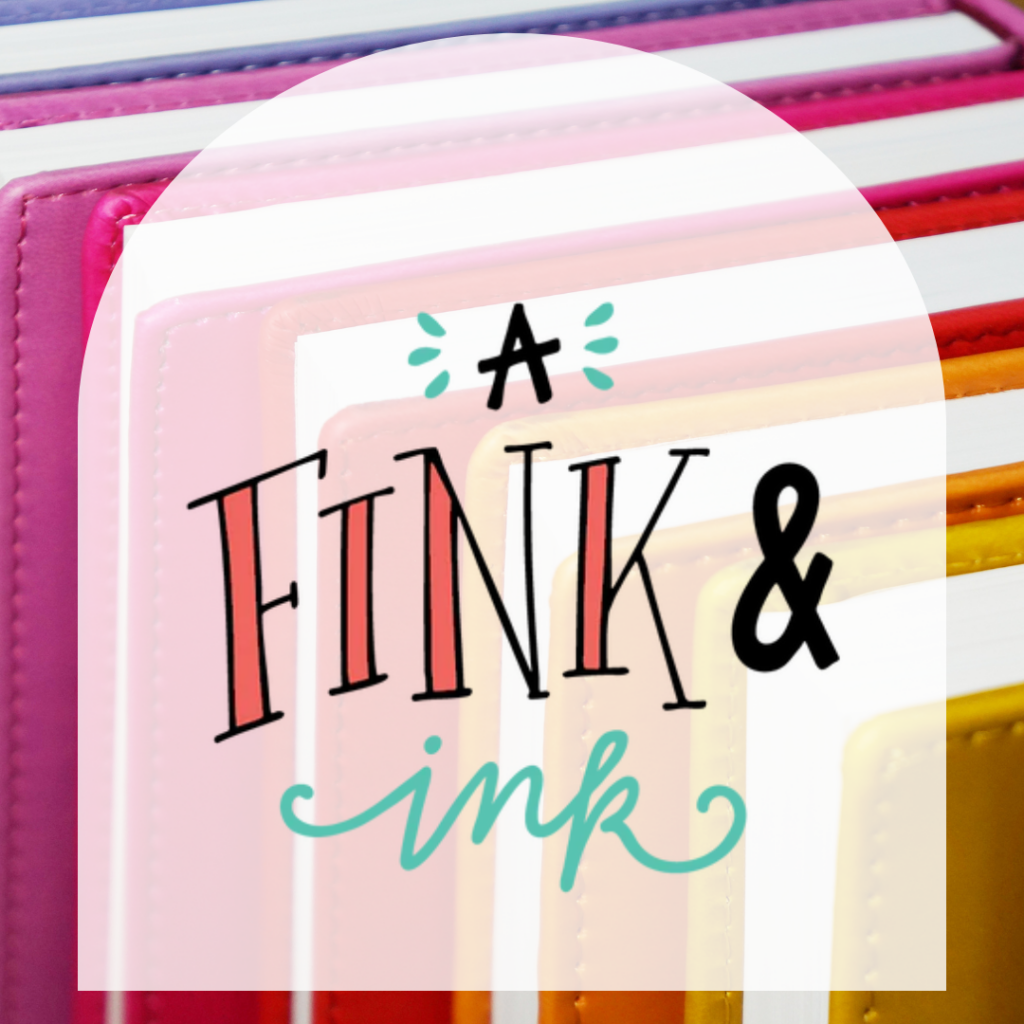 Picture of rainbow books with white arch in front if it that says "A Fink & Ink"